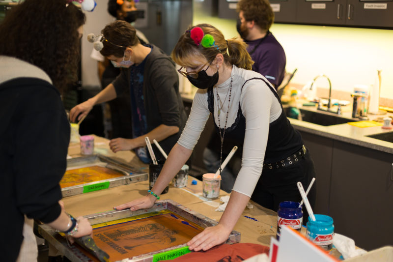 People screenprinting at Youth Invasion.