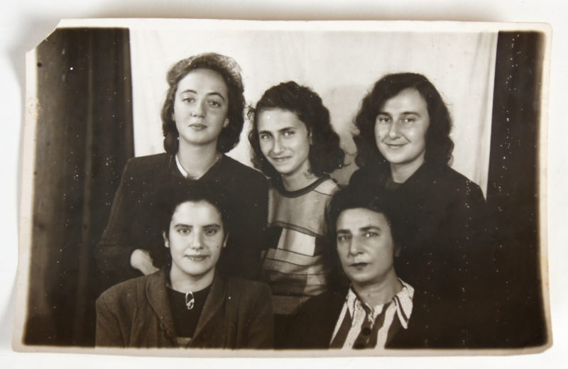 Black and white photograph of six women smiling for the camera.