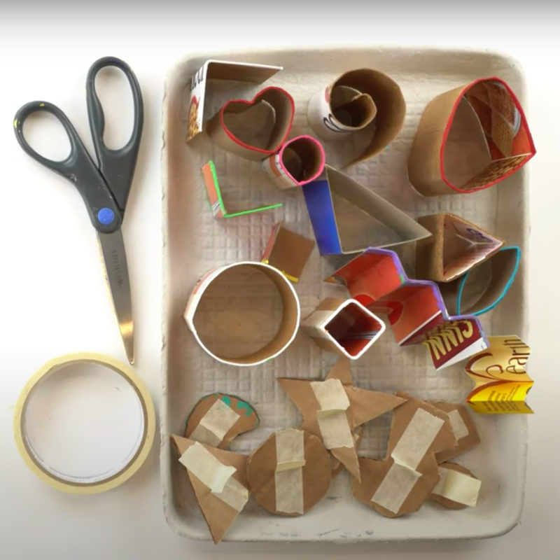 View from above of desk with scissors and cardboard.