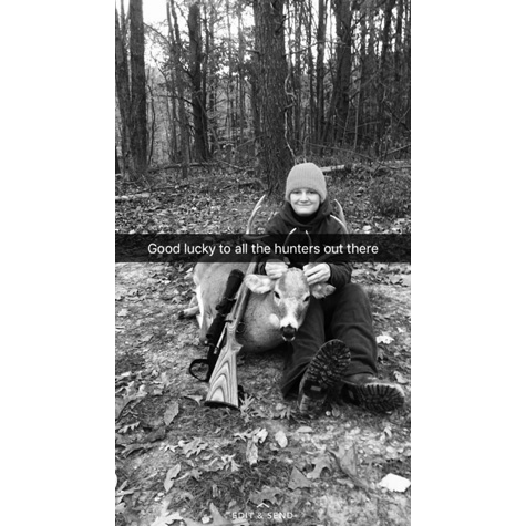 Image of a woman holding a dead deer